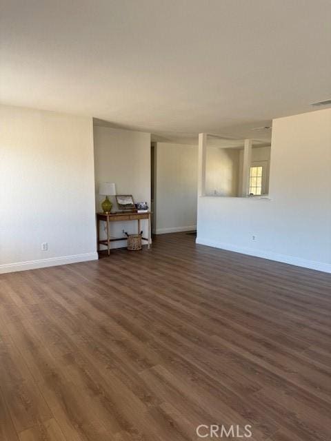 17949 Catalpa St, Hesperia, CA 92345 - empty room with dark wood-style floors and baseboards