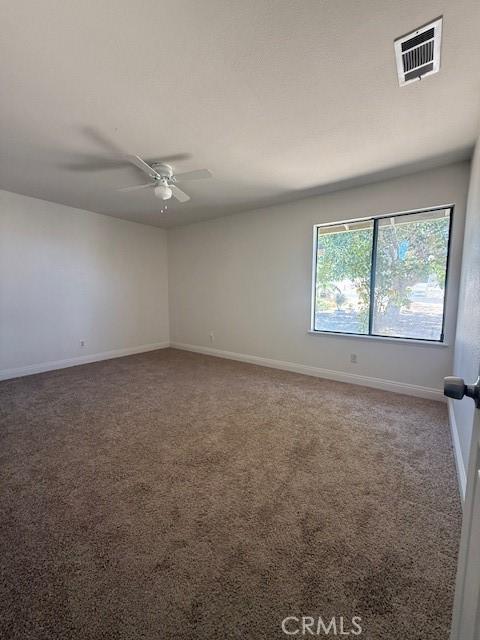 17949 Catalpa St, Hesperia, CA 92345 - carpeted empty room with baseboards and a ceiling fan