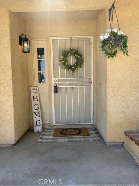 17949 Catalpa St, Hesperia, CA 92345 - view of exterior entry featuring stucco siding