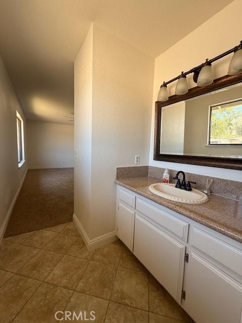 17949 Catalpa St, Hesperia, CA 92345 - bathroom with tile patterned flooring and vanity