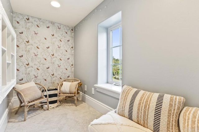 sitting room featuring plenty of natural light, carpet flooring, baseboards, and wallpapered walls