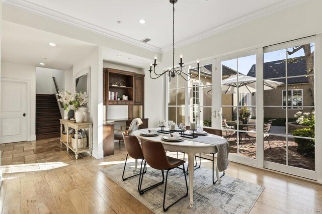 dining area with stairway, crown molding, light wood-style floors, and recessed lighting