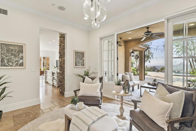 sitting room featuring baseboards, stone tile floors, crown molding, recessed lighting, and arched walkways