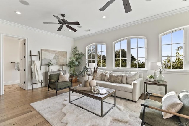 living room with ceiling fan, light wood-type flooring, ornamental molding, baseboards, and recessed lighting