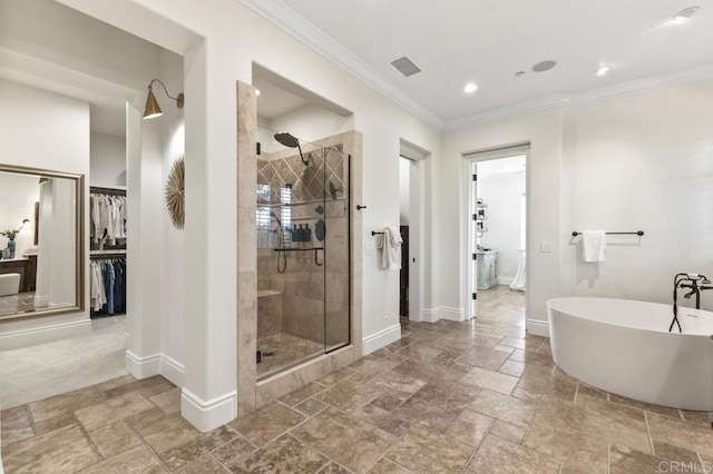 full bath featuring stone tile flooring, baseboards, a shower stall, crown molding, and recessed lighting