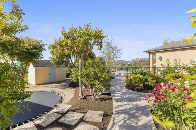 surrounding community featuring a storage shed and an outdoor structure