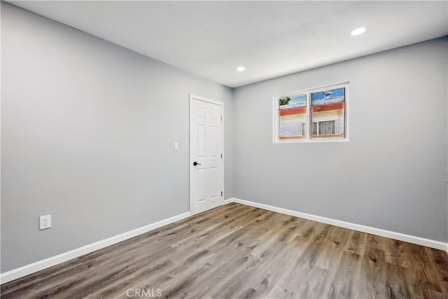 43820 Beech Ave, Lancaster, CA 93534 - empty room with wood finished floors, baseboards, and recessed lighting