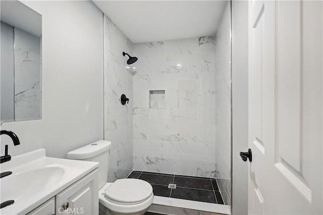 43820 Beech Ave, Lancaster, CA 93534 - bathroom featuring a marble finish shower, vanity, and toilet
