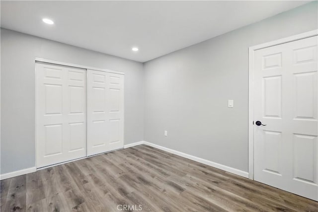 43820 Beech Ave, Lancaster, CA 93534 - unfurnished bedroom with wood finished floors, baseboards, recessed lighting, and a closet