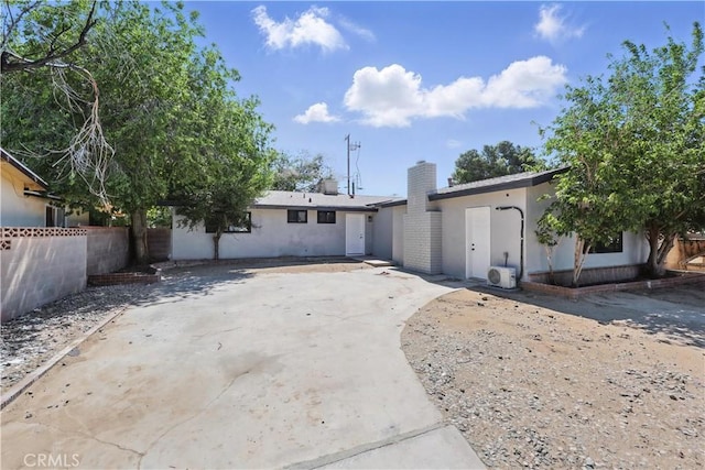43820 Beech Ave, Lancaster, CA 93534 - view of front of property featuring fence, a chimney, a patio area, and stucco siding