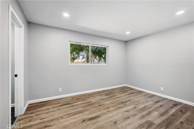 43820 Beech Ave, Lancaster, CA 93534 - unfurnished bedroom featuring wood finished floors, recessed lighting, and baseboards