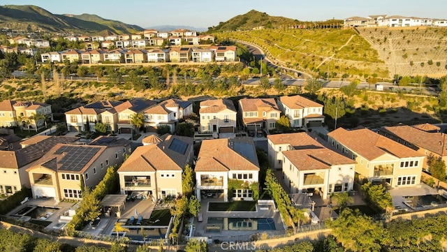 aerial view of residential area featuring a mountain backdrop