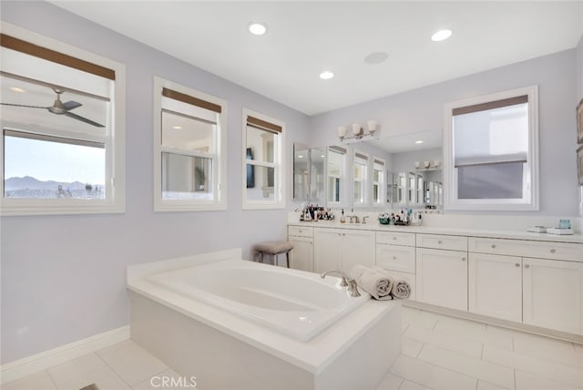 full bath with tile patterned flooring, a garden tub, baseboards, vanity, and recessed lighting