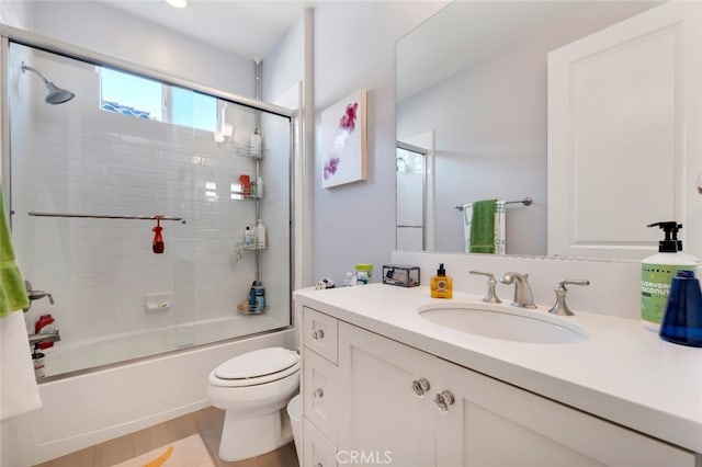 full bathroom with toilet, combined bath / shower with glass door, and vanity