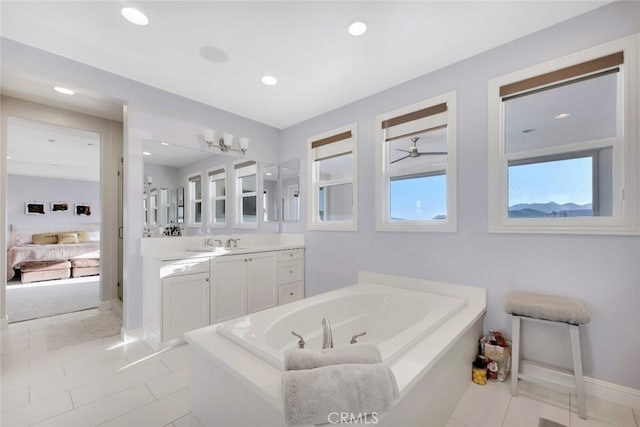 full bathroom with connected bathroom, a garden tub, vanity, baseboards, and tile patterned floors