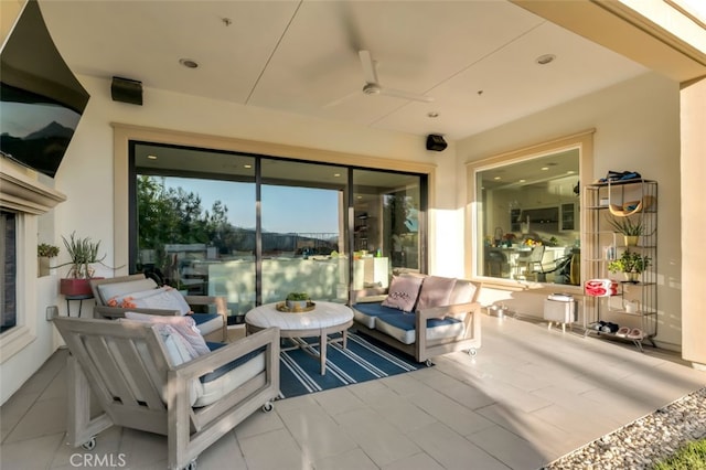 view of patio featuring an outdoor living space and a ceiling fan