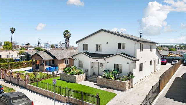view of front of home featuring stucco siding and a residential view
