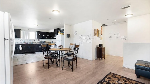 dining room featuring light wood-style flooring