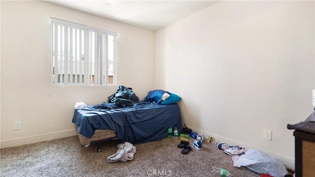 unfurnished bedroom featuring baseboards and carpet