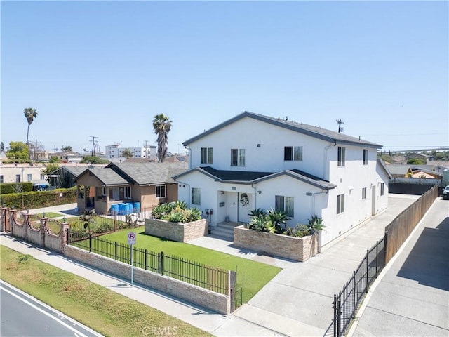 view of front of house with stucco siding and a residential view