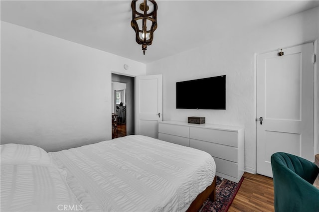 bedroom featuring wood finished floors
