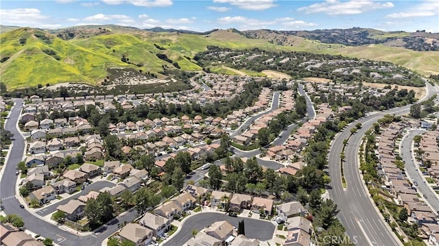 aerial overview of property's location with nearby suburban area and mountains