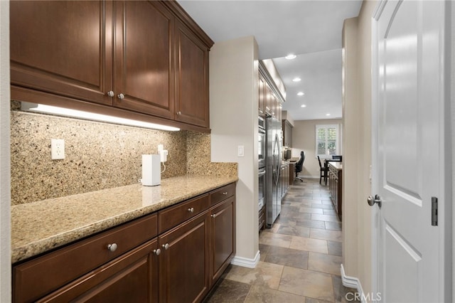 14538 Eagle River Rd, Eastvale, CA 92880 - kitchen featuring baseboards, backsplash, recessed lighting, light stone counters, and light stone finish floors