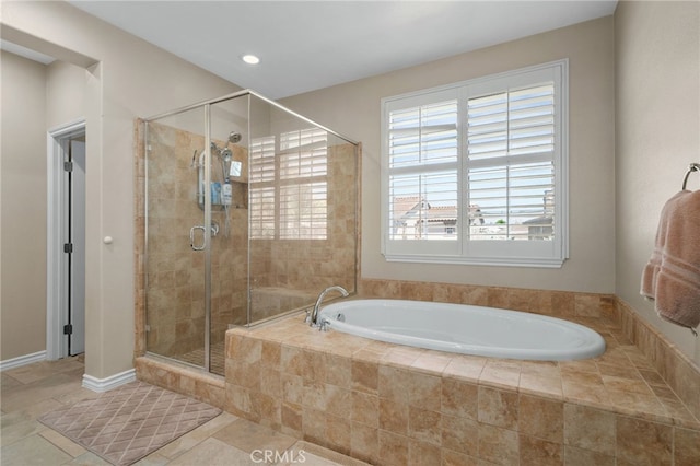 14538 Eagle River Rd, Eastvale, CA 92880 - full bathroom featuring a stall shower, a bath, and recessed lighting