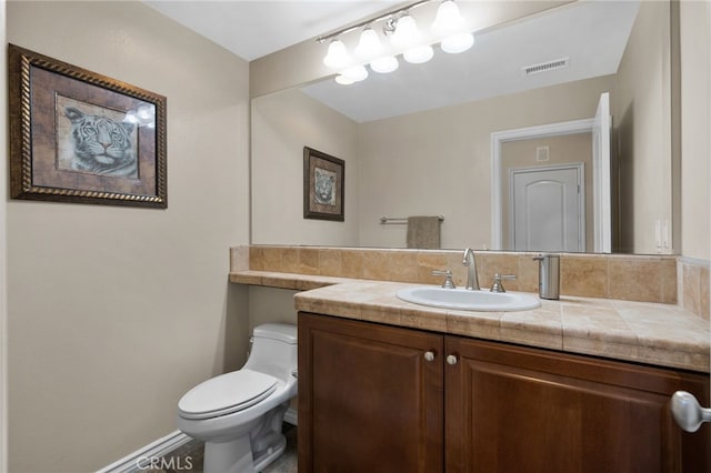 14538 Eagle River Rd, Eastvale, CA 92880 - half bath featuring toilet, vanity, and baseboards
