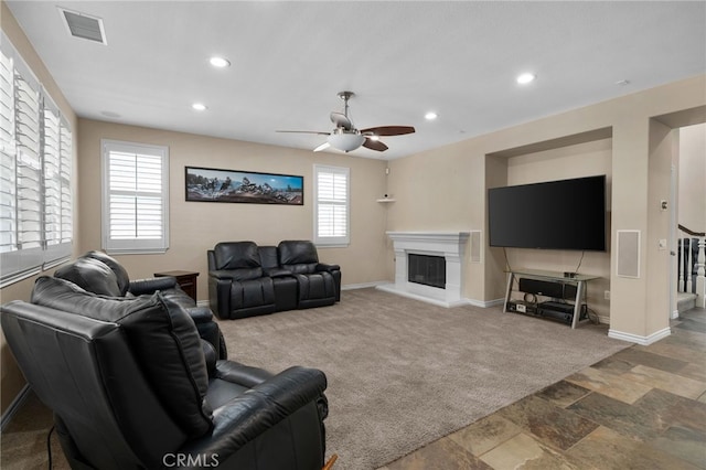 14538 Eagle River Rd, Eastvale, CA 92880 - living area with baseboards, carpet floors, a ceiling fan, a glass covered fireplace, and recessed lighting