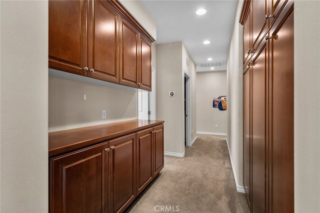 14538 Eagle River Rd, Eastvale, CA 92880 - hallway featuring light colored carpet, baseboards, and recessed lighting