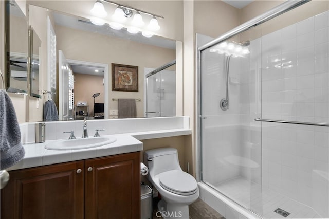 14538 Eagle River Rd, Eastvale, CA 92880 - bathroom featuring a shower stall, vanity, and toilet