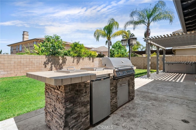 14538 Eagle River Rd, Eastvale, CA 92880 - view of patio with an outdoor kitchen, grilling area, a pergola, and a fenced backyard
