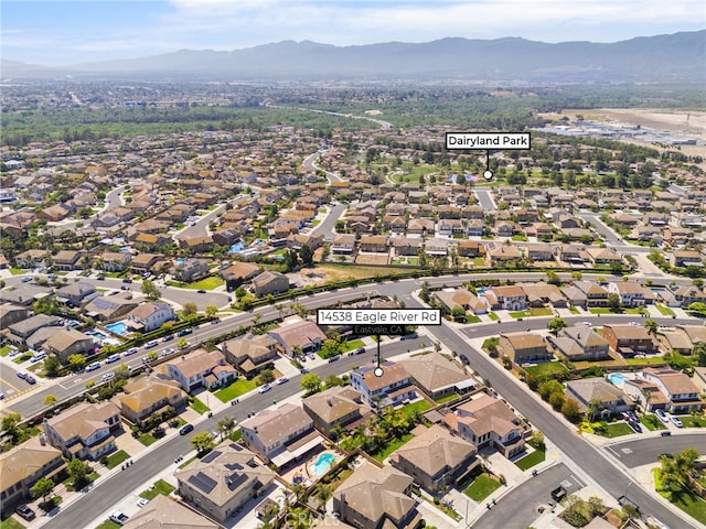 14538 Eagle River Rd, Eastvale, CA 92880 - aerial view of property's location with mountains and nearby suburban area