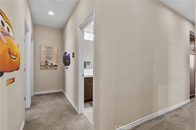 14538 Eagle River Rd, Eastvale, CA 92880 - hallway with light carpet and baseboards