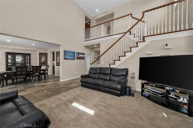 14538 Eagle River Rd, Eastvale, CA 92880 - living room featuring a towering ceiling, baseboards, recessed lighting, and stairs