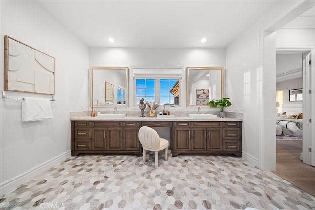 100 Headwaters, Irvine, CA 92602 - bathroom with double vanity, ensuite bathroom, recessed lighting, and baseboards