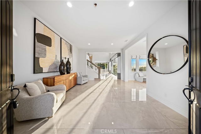 100 Headwaters, Irvine, CA 92602 - living area with marble tiled flooring, stairs, recessed lighting, and baseboards