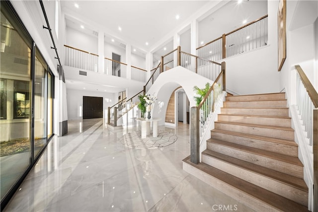 100 Headwaters, Irvine, CA 92602 - stairs featuring a towering ceiling, marble tiled flooring, and recessed lighting
