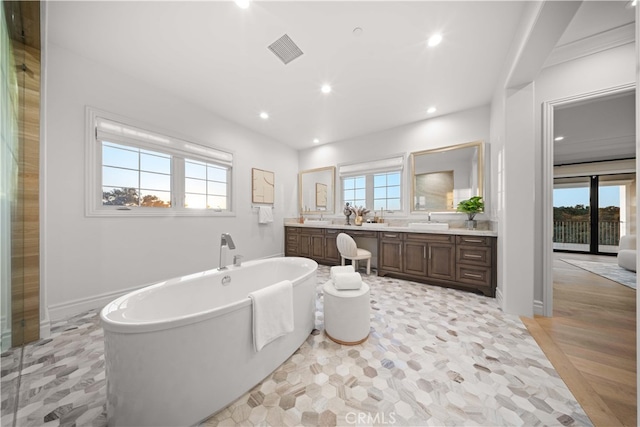 100 Headwaters, Irvine, CA 92602 - bathroom with double vanity, a soaking tub, and recessed lighting