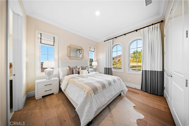 100 Headwaters, Irvine, CA 92602 - bedroom featuring crown molding, baseboards, and light wood-type flooring