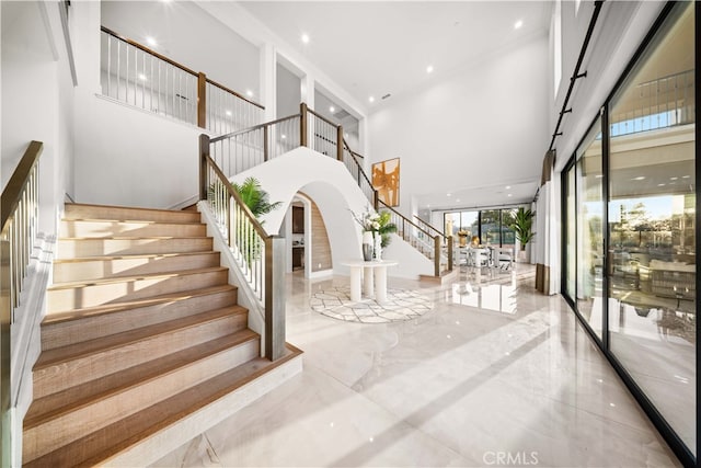 100 Headwaters, Irvine, CA 92602 - stairs with a towering ceiling, marble finish flooring, and arched walkways