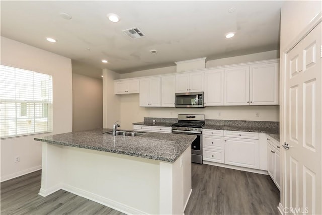 7460 Jersey St, Chino, CA 91708 - kitchen with appliances with stainless steel finishes, a sink, white cabinets, and recessed lighting