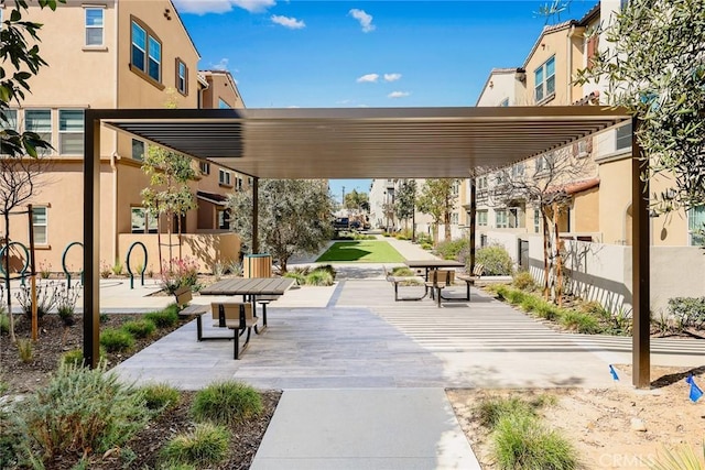 surrounding community with a residential view and fence
