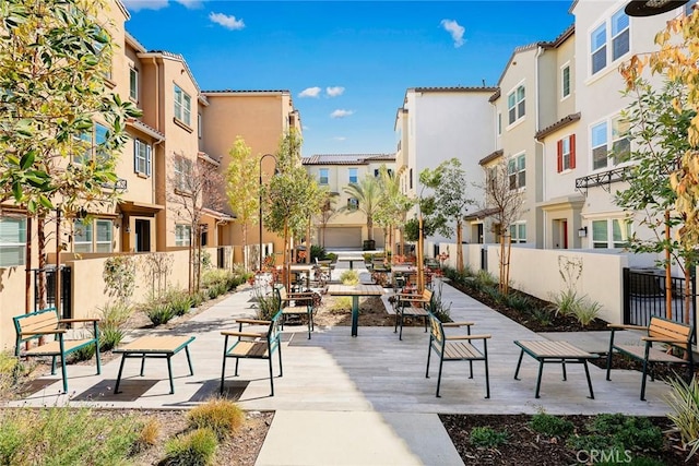 surrounding community with a residential view and fence