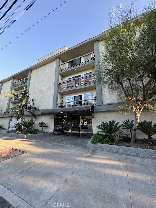 2844 E 3rd St Unit 210, Long Beach, CA 90814 - view of building exterior featuring covered parking