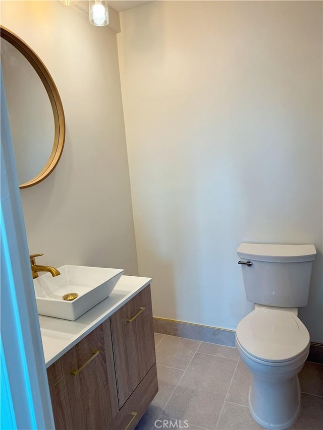 2844 E 3rd St Unit 210, Long Beach, CA 90814 - half bath with vanity, toilet, baseboards, and tile patterned floors