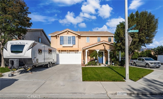 7189 Myrtle Pl, Fontana, CA 92336 - view of front of home featuring driveway, an attached garage, stucco siding, and a front lawn