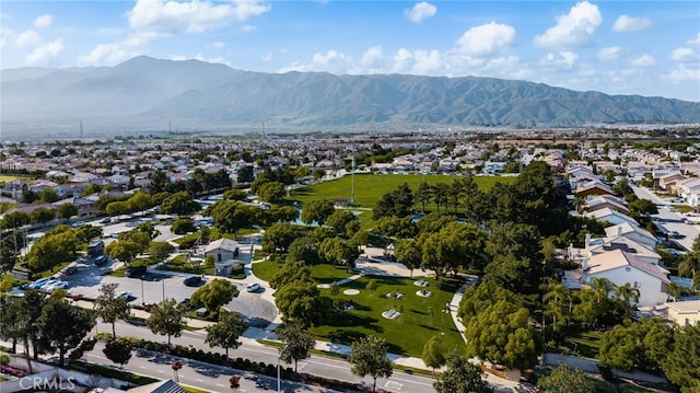 7189 Myrtle Pl, Fontana, CA 92336 - aerial view of property and surrounding area featuring a mountainous background and nearby suburban area