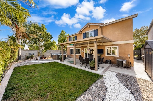 7189 Myrtle Pl, Fontana, CA 92336 - back of house featuring stucco siding, central air condition unit, a hot tub, and a patio